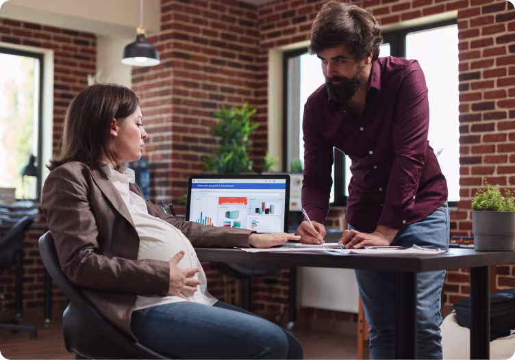 Maternity Pay 8 Maternity pay banner pregnant woman by desk getting advice